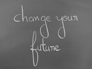 Change your future message written on a chalkboard in white handwritten script