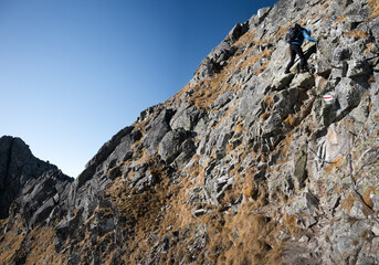 Climbing, high mountain trekking in the High Tatras. Belay elements in the mountains, buckles, chains and ladders.
