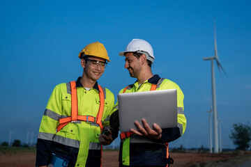 Diverse ethnicity male technicians working in the wind turbines field. 