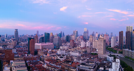 Aerial view of high-rise buildings and residential houses in Shanghai at dawn