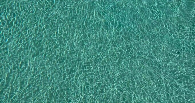 Ripples of water in a swimming pool.
