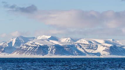 View of the Isfjorden fjord and mountains from Longyearbyen, the most northernmost town in the world. Svalbard is a Norwegian archipelago between mainland Norway and the North Pole.