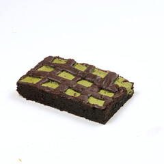 Delicious checkered dessert features layers of chocolate and green filling, showcasing an appealing design perfect for sweet lovers