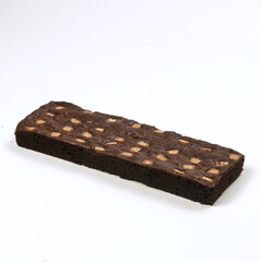 A tasty chocolate brownie features chunks of nuts baked into a rich, dark dessert, perfect for...