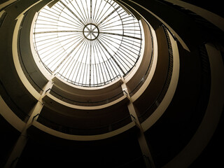 Staircase in the night with a top dome of glass and grill 