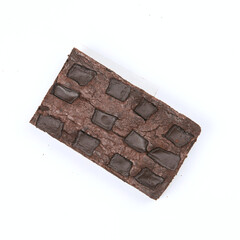 Indulging in rich brownies topped with chocolate pieces, showcasing a simple and enticing treat for dessert enthusiasts