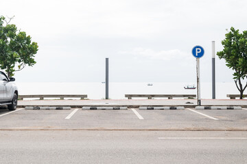 Empty parking lot against sea and beautiful sky. © yotrakbutda