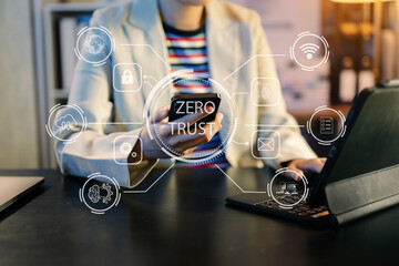 Zero trust security concept Person using computer and tablet with zero trust icon on virtual screen
