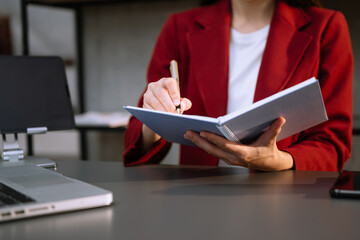 Businesswoman utilizing smartphone and tablet technology. Perfect for corporate, technology,