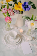 Elegant Breakfast Table Setting with Spring Flowers in Soft Tones