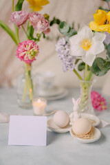 Mockup card on Elegant Breakfast Table Setting with Spring Flowers in Soft Tones