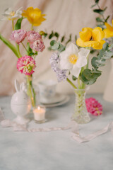 Elegant Breakfast Table Setting with Spring Flowers in Soft Tones