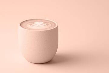 A ceramic cup of mocha mousse latte with foam art in a stylish beige background. Modern trendy tone hue shade