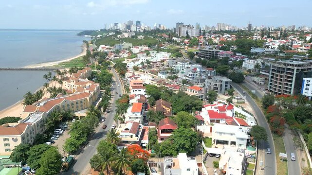 Maputo, Mozambique - The Stunning Coastline Features Contemporary Buildings and a Serene Shoreline - Aerial Drone Shot