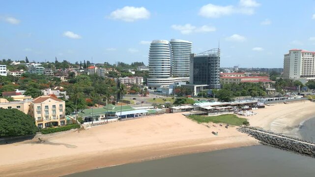 Maputo, Mozambique - A Picturesque Vista of Modern Beachfront Buildings Set Against the Clear Blue Sky - Aerial Drone Shot