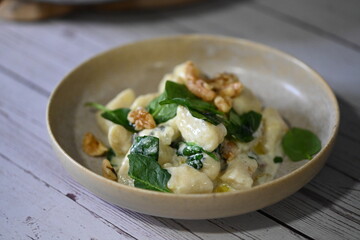 Homemade Potato Gnocchi with Spinach, Blue Cheese, and Walnuts – Creamy Sauce