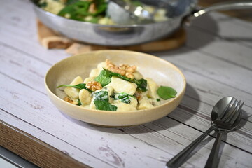 Homemade Potato Gnocchi with Spinach, Blue Cheese, and Walnuts – Creamy Sauce