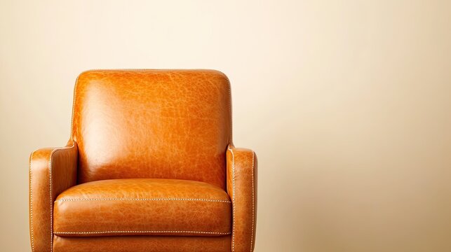 close-up of textured leather armchair with visible stitching positioned in minimalist room under ambient lighting