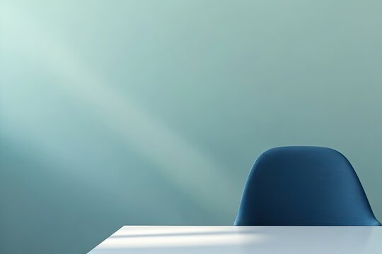 close-up of minimalist workspace with clean white desk and bold blue chair under bright natural light