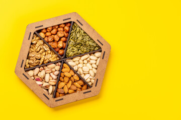 A vibrant assortment of various nuts, including almonds, walnuts, hazelnuts, cashews, and pistachios