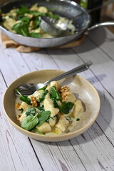 Homemade Potato Gnocchi with Spinach, Blue Cheese, and Walnuts – Creamy Sauce