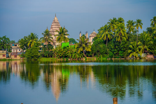 Scenic View of Shiva Temple in Puthia Upazila, Rajshahi, Bangladesh, with Reflection in a Serene Lake