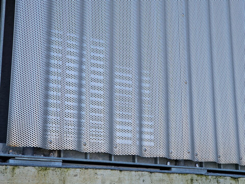 building is lined with square panels. metal sheet wall cladding with scalloped design. corrugated sheet, dark gray, riveted. horizontal stripes, shadows, corner, fence, aluminium, sheet, hotel
terrace - Powered by Adobe
