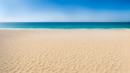 Obraz premium Panoramic view of a pristine sandy beach meeting a turquoise ocean under a clear blue sky.