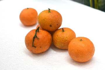 delicious Honey Santang Oranges (Citrus sinensis). 
Very sweet and juicy, white background