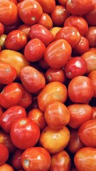 Pile of Fresh Ripe Tomatoes Displayed at a Market