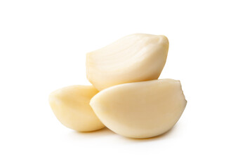 Side view of peeled garlic cloves or pieces in stack isolated on white background with clipping path