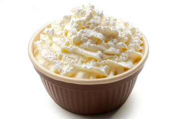Delicious whipped cream topped dessert in a brown bowl ready for serving at a kitchen counter
