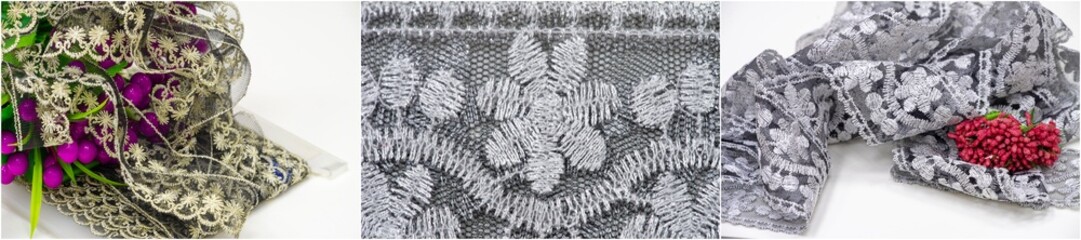 A close-up of a beautifully patterned lace fabric with intricate floral embroidery in silver and...