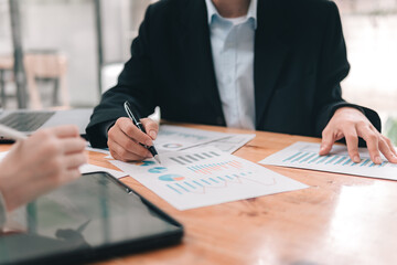 Indoor business meeting overview close-up document analysis