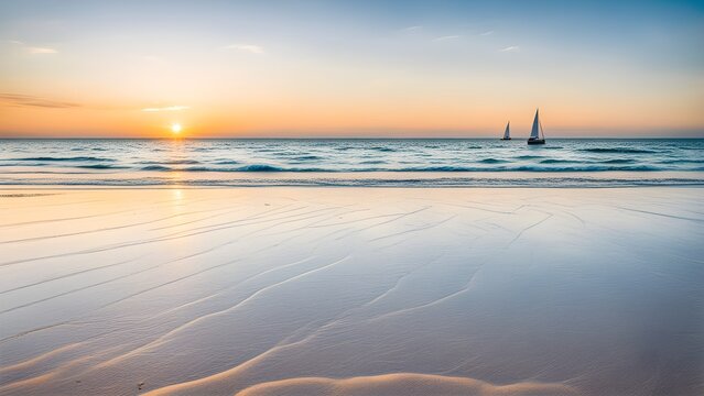 Serene sunset over a tranquil ocean beach with sailboats on the horizon, showcasing a soft, textured foreground of wet sand.