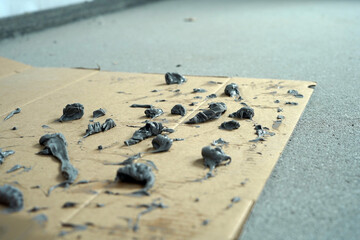 Cardboard into which construction silicone was rubbed.
