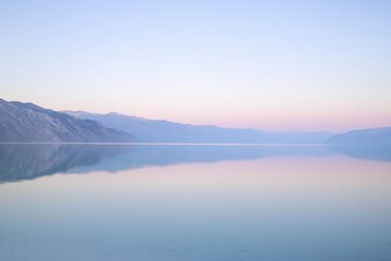 Sunrise Over Lake Gradient: A serene lake with a sky transitioning from pale pink at the horizon to deep blue at the top.