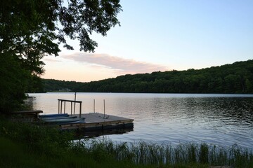 Sunrise Over Lake Gradient: A serene lake with a sky transitioning from pale pink at the horizon to deep blue at the top.