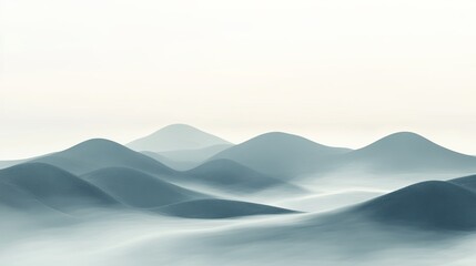 Fototapeta premium Misty Morning Hills: Rolling hills partially shrouded in early morning mist. picture