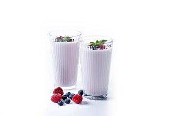 Fresh raspberry and blueberry smoothie isolated on white background