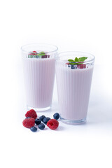 Fresh raspberry and blueberry smoothie isolated on white background