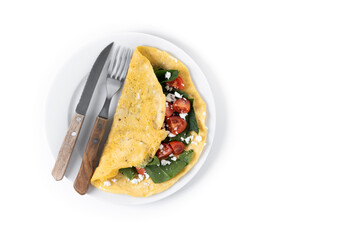 Stuffed omelette with tomatoes and spinach isolated on white background. Top view. Copy space