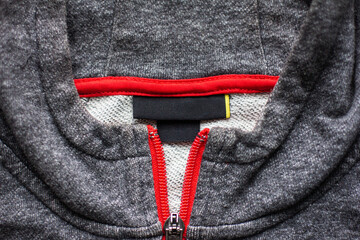 Mockup of a label and an inner label on the neck of a pretty sweater. Blank space to place a logo, text or image