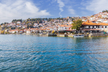 Picturesque view of Ohrid, North Macedonia, a historic town on Lake Ohrid shore, known for its charming architecture and stunning lake views, making it a popular tourist destination.