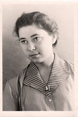 Donbass, Ukraine, USSR - circa 1960: Vintage portrait of a beautiful young woman.