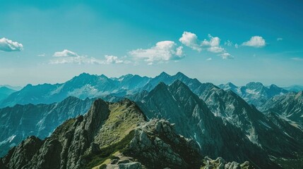 Obraz premium Majestic Mountain Range under a Bright Sky
