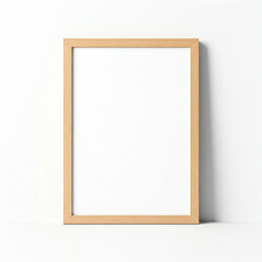 Obraz premium picture frame on a white wall. Minimal wooden picture poster frame mockup on white wallpaper.