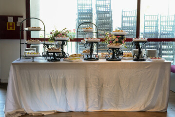 A table with savory food served on stylish stands