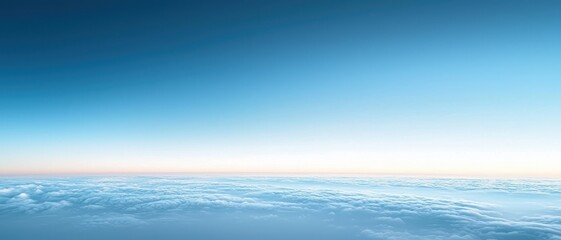 Obraz premium Vast blue sky with soft clouds at dawn or dusk.