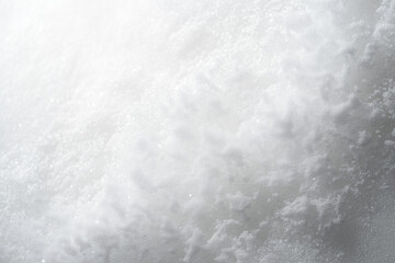 white and grey gradient background with a soft grain texture, close-up view. Web banner with copy space in the bottom right corner on a white background.